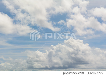 A refreshing blue sky with various cloud patterns and dynamic cumulus clouds as background material. A refreshing blue sky with various cloud patterns and dynamic cumulus clouds as background material. 142077772