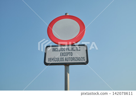Traffic sign prohibiting vehicles and scooters except authorized ones 142078611