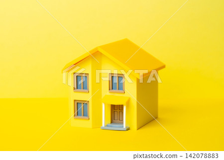 Yellow house on a Yellow background. Buying a house. Real estate. Mortgage decisions. Property value. Down payment calculation. Asset growth opportunity. Yellow house on a Yellow background. Buying a house. Real estate. Mortgage decisions. Property value. Down payment calculation. Asset growth opportunity. 142078883