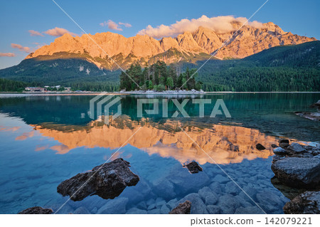 Eibsee Lake Sunset with Maximiliansinsel Island and Zugspitze Mountain Germany Eibsee Lake Sunset with Maximiliansinsel Island and Zugspitze Mountain Germany 142079221