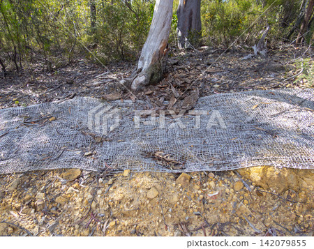 A cloth flood containment barrier near a dirt track in the Blue Mountains A cloth flood containment barrier near a dirt track in the Blue Mountains 142079855