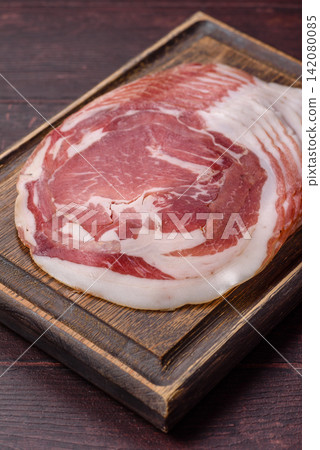 Slices of pork pancetta, ham, or bacon for a festive antipasto platter Slices of pork pancetta, ham, or bacon for a festive antipasto platter 142080085