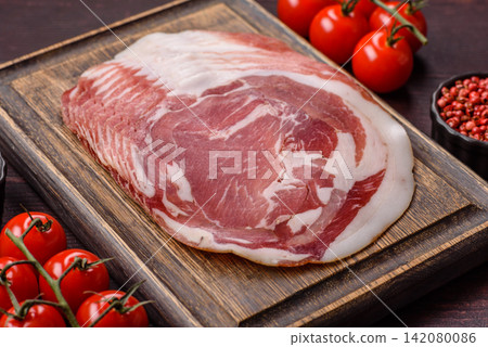 Slices of pork pancetta, ham, or bacon for a festive antipasto platter Slices of pork pancetta, ham, or bacon for a festive antipasto platter 142080086