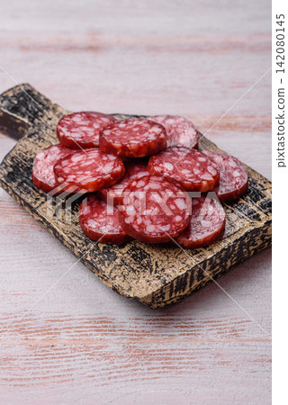 Slices of smoked salami for sandwiches or a lunch spread. Salami slices Slices of smoked salami for sandwiches or a lunch spread. Salami slices 142080145