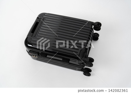 Close-up of a black carry-on suitcase. Close-up of a black carry-on suitcase. 142082361