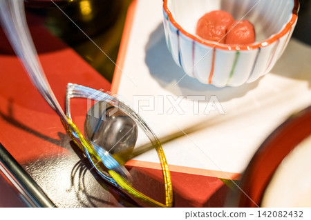 A celebratory meal featuring decorative ornaments and small bowls. 142082432