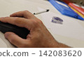 Horizontal Close up view of Office Desk Setup with Mouse, Pen, folders and Correction Tape 142083620