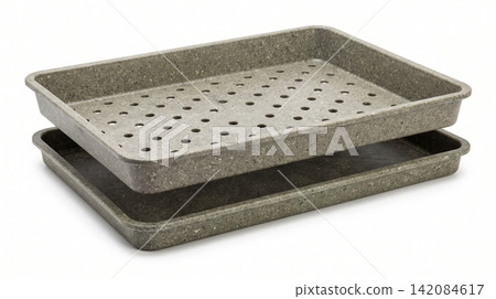 Two stacked plastic seedling trays with drainage holes on white background seedling drainage propagation germination gardening agriculture cultivation greenhouse speckled rectangular Two stacked plastic seedling trays with drainage holes on white background seedling drainage propagation germination gardening agriculture cultivation greenhouse speckled rectangular 142084617