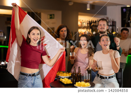 Group of fans in bar with Canadian flag Group of fans in bar with Canadian flag 142084858