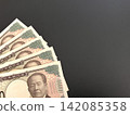 Black background and five 10,000 yen bills 142085358