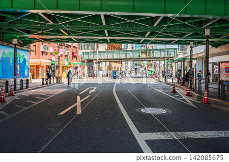 Street road under green steel railway bridge near Takadanobaba in Tokyo Japan Street road under green steel railway bridge near Takadanobaba in Tokyo Japan 142085675