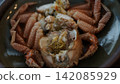 Boiled hairy crab and rich crab miso packed in the shell 142085929