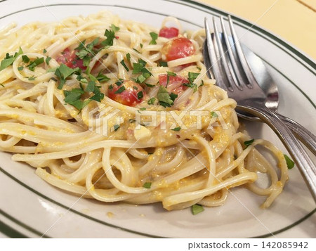 Pasta with bottarga and tomatoes Pasta with bottarga and tomatoes 142085942