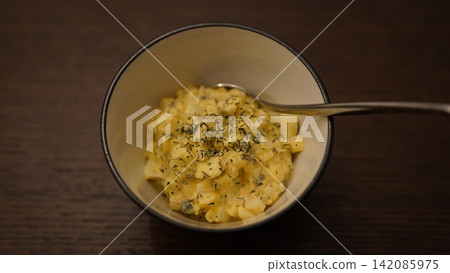 Homemade tartar sauce with plenty of boiled eggs and herbs Homemade tartar sauce with plenty of boiled eggs and herbs 142085975