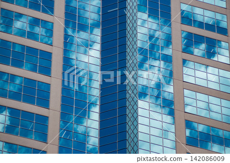 Clouds reflecting off office buildings in the business district Clouds reflecting off office buildings in the business district 142086009