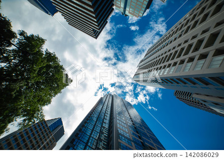 Clouds reflecting off office buildings in the business district Clouds reflecting off office buildings in the business district 142086029