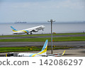 An AIR DO aircraft taking off from Haneda Airport 142086297