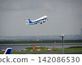 ANA machine to take off at Haneda Airport 142086530