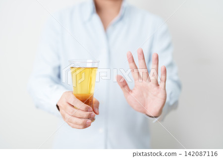 man making stop hand gesture to refuse a glass of Beer, Healthy man say no to alcohol drink, stop alcoholism and addiction concept. Responsible man reject a drink before driving and quit booze man making stop hand gesture to refuse a glass of Beer, Healthy man say no to alcohol drink, stop alcoholism and addiction concept. Responsible man reject a drink before driving and quit booze 142087116