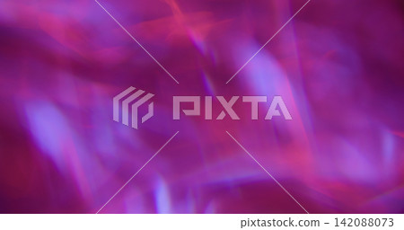 Defocused glow light. Art flare. Pink blue purple colorful lens glisten rainbow radiant kaleidoscope on abstract neon bokeh background. Defocused glow light. Art flare. Pink blue purple colorful lens glisten rainbow radiant kaleidoscope on abstract neon bokeh background. 142088073