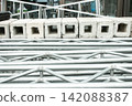 A scene of scaffolding materials piled up. 142088387