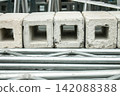 A scene of scaffolding materials piled up. 142088388