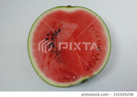 Photo: Cut watermelon with red flesh Photo: Cut watermelon with red flesh 142089296