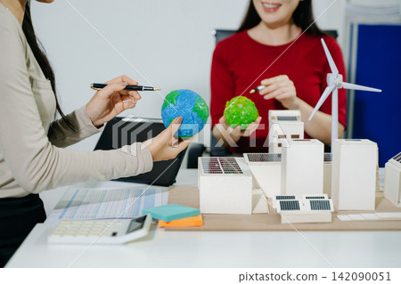 business team people planning and discussing on recycle reduce reuse policy symbol in office meeting room. Green business company a business team people planning and discussing on recycle reduce reuse policy symbol in office meeting room. Green business company a 142090051