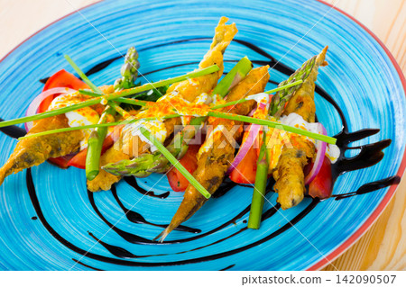 Battered sprats with creamy ginger sauce, tomatoes, balsamic Battered sprats with creamy ginger sauce, tomatoes, balsamic 142090507
