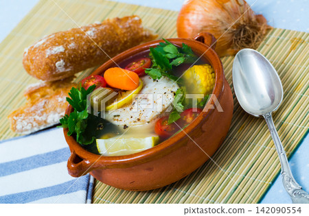 Fisherman's hoosh boiled with alaska pollock, carrots, corn and lemon Fisherman's hoosh boiled with alaska pollock, carrots, corn and lemon 142090554
