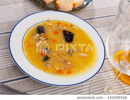 delicious pea soup with smoked meats delicious pea soup with smoked meats 142090588