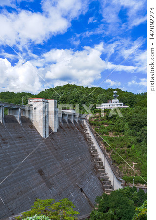 Dam embankment and summer sky above; Nunome Dam; 35mm; blank copy space above; vertical composition; dam in the center; suitable for B1 poster. Dam embankment and summer sky above; Nunome Dam; 35mm; blank copy space above; vertical composition; dam in the center; suitable for B1 poster. 142092273
