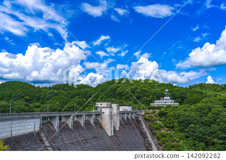Dam and clear blue sky; Nunome Dam; 35mm; blank copy space at the top; horizontal composition, dam on the left; suitable for B0 poster. Dam and clear blue sky; Nunome Dam; 35mm; blank copy space at the top; horizontal composition, dam on the left; suitable for B0 poster. 142092282