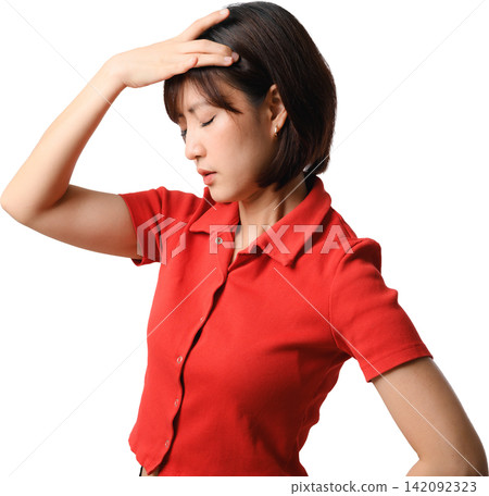 Tired asian woman feeling severe headache pain and stress holding forehead wearing red shirt while standing against isolated background Tired asian woman feeling severe headache pain and stress holding forehead wearing red shirt while standing against isolated background 142092323