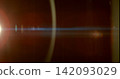 Warm anamorphic lens flare overlay featuring a golden light source, blue horizontal light streak, realistic optical reflections and subtle glow on a black background. Premium VFX asset for Warm anamorphic lens flare overlay featuring a golden light source, blue horizontal light streak, realistic optical reflections and subtle glow on a black background. Premium VFX asset for 142093029