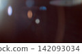 Cinematic lens flare overlay featuring soft optical reflections, subtle blue and warm orange light artifacts and realistic glow on a black background. Premium VFX asset for film compositing. Cinematic lens flare overlay featuring soft optical reflections, subtle blue and warm orange light artifacts and realistic glow on a black background. Premium VFX asset for film compositing. 142093034
