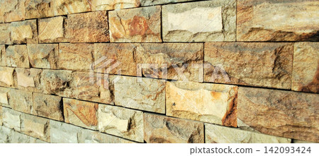 Textured natural sandstone wall cladding block background Textured natural sandstone wall cladding block background 142093424