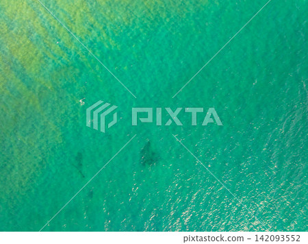 Bird eye view photo of sea beach water surface texture background Bird eye view photo of sea beach water surface texture background 142093552