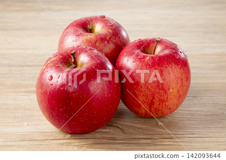 3 pieces of Fuji apple 3 pieces of Fuji apple 142093644