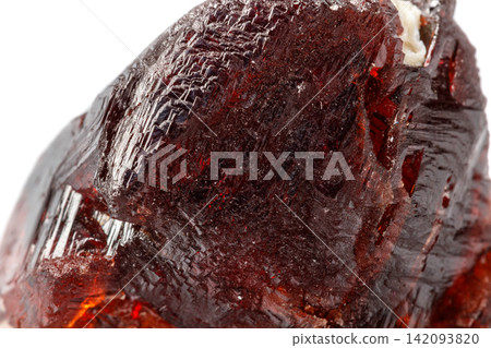 Macro mineral stone Garnet Spessartine on a white background Macro mineral stone Garnet Spessartine on a white background 142093820