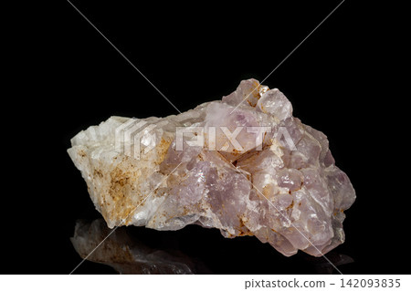 Macro mineral amethyst quartz stone on a black background Macro mineral amethyst quartz stone on a black background 142093835