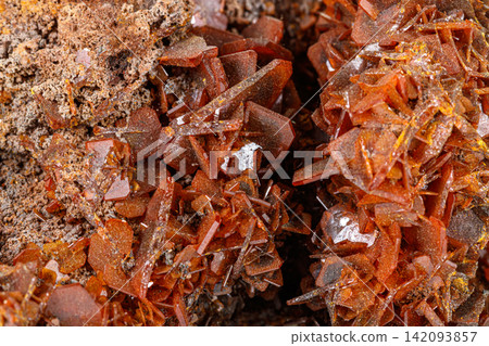 Macro stone mineral Wulfenite on a white background Macro stone mineral Wulfenite on a white background 142093857