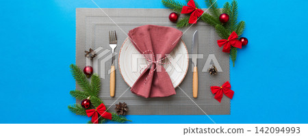 Christmas dinner background with rustic decorations and kitchen utensil . View from above Christmas dinner background with rustic decorations and kitchen utensil . View from above 142094993