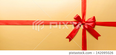 Top view of Red ribbon rolled and red bow isolated on colored background. Flat lay with copy space Top view of Red ribbon rolled and red bow isolated on colored background. Flat lay with copy space 142095026