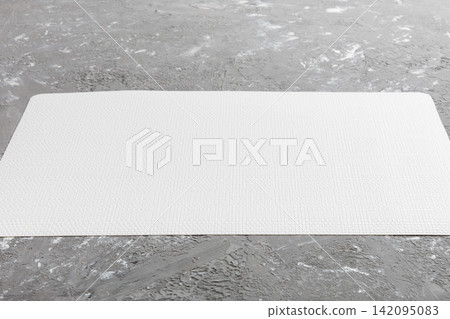 Perspective view of tablecloth for food on cement background. Empty space for your design Perspective view of tablecloth for food on cement background. Empty space for your design 142095083