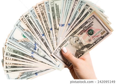 Top view of female hand giving a fan of dollar bills on isolated background. Profit and luxury concept Top view of female hand giving a fan of dollar bills on isolated background. Profit and luxury concept 142095149