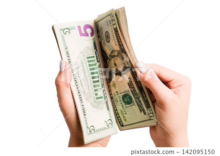 Isolated image of female hands counting dollars on white background. Top view of salary and wages concept Isolated image of female hands counting dollars on white background. Top view of salary and wages concept 142095150