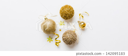 Christmas ball on colored background. decoration bauble with ribbon bow with copy space Christmas ball on colored background. decoration bauble with ribbon bow with copy space 142095183