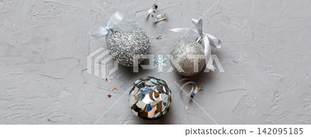 Christmas ball on colored background. decoration bauble with ribbon bow with copy space Christmas ball on colored background. decoration bauble with ribbon bow with copy space 142095185