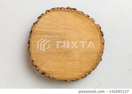 Top view of wooden serving tray on cement background. Empty space for your design Top view of wooden serving tray on cement background. Empty space for your design 142095227